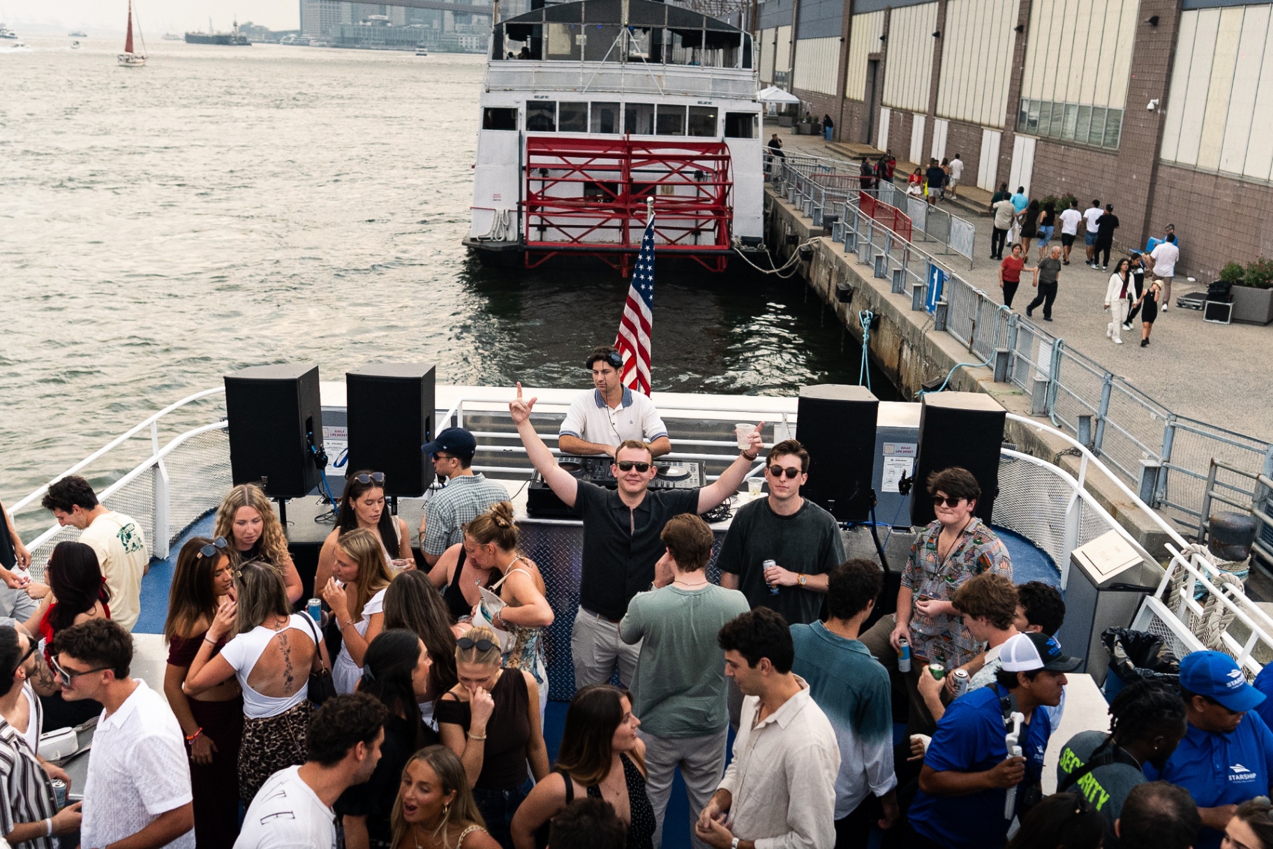 Boat on the water with the NYC skyline