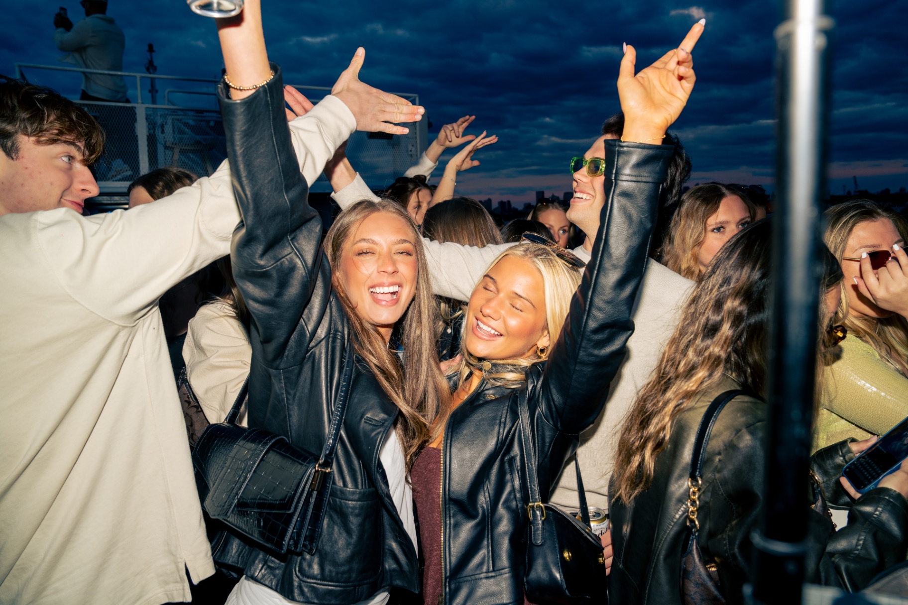 Hands up on the dance floor at dusk